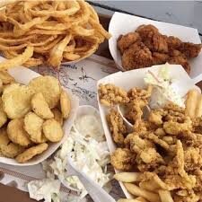 images (1) Fried pickles. onion rings, clam strips in paper baskets. Menu items